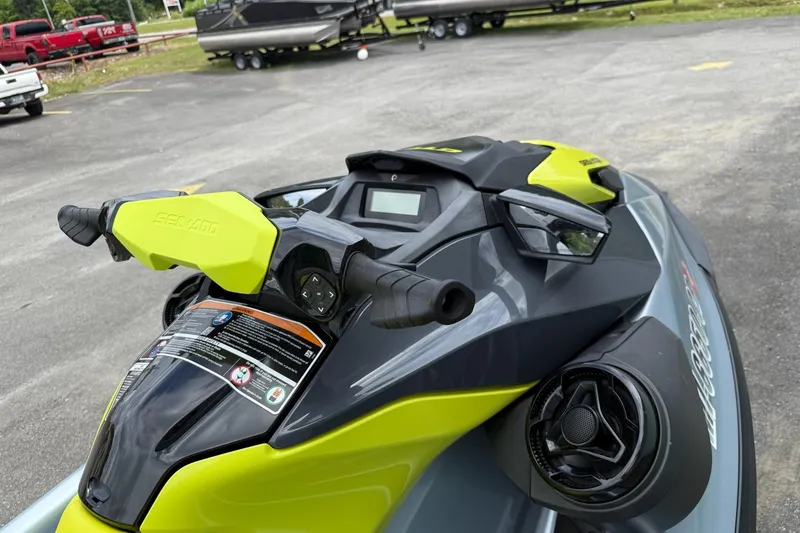 Slide: The Image of 2021 Seadoo GTI SE 130 jet ski with sound system, vibrant yellow and gray design. - 3