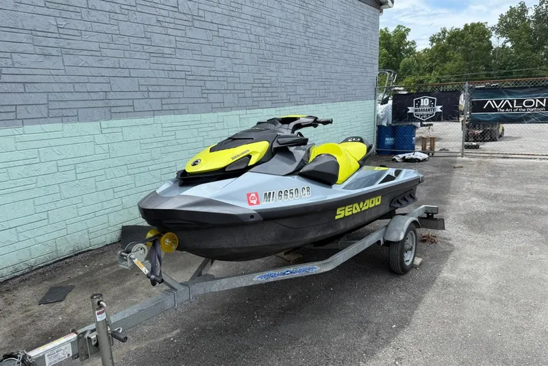 Slide: The Image of 2021 Seadoo GTI SE 130 with Sound System on trailer, parked outdoors. - 6