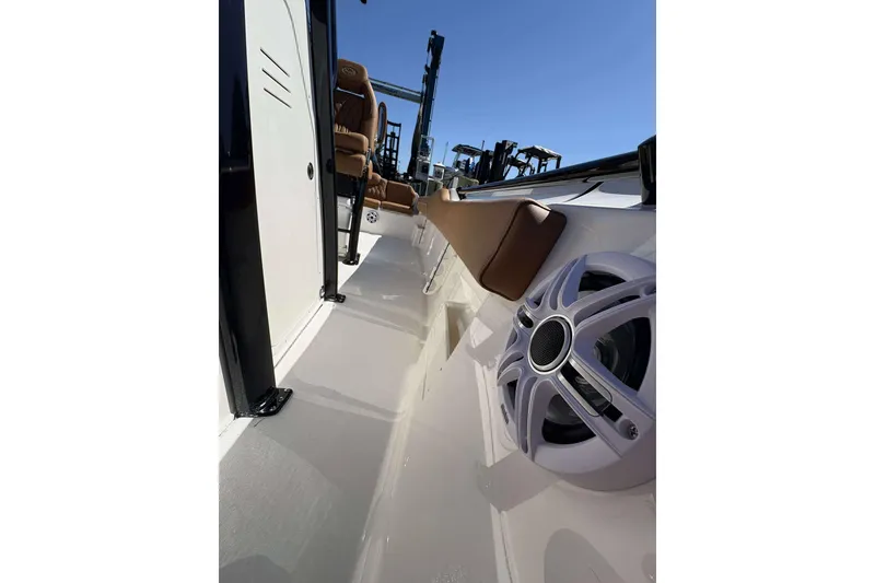 Slide: The Image of 2026 Key West 239 FS boat interior with speaker and seating, showcasing modern design. - 16