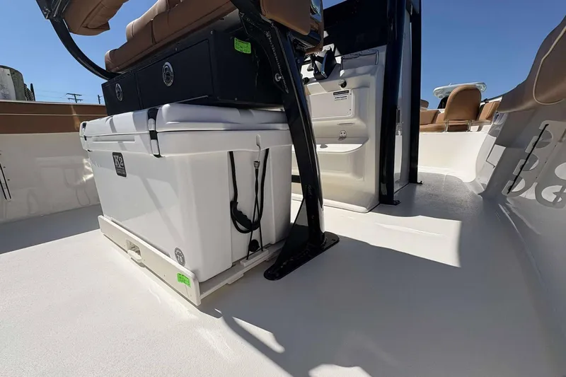 Slide: The Image of 2026 Key West 239 FS boat interior with seating and storage compartments. - 17