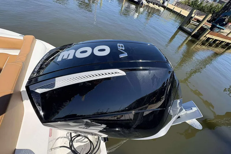 Slide: The Image of 2026 Key West 239 FS boat with powerful V8 Mercury outboard engine on calm water. - 19