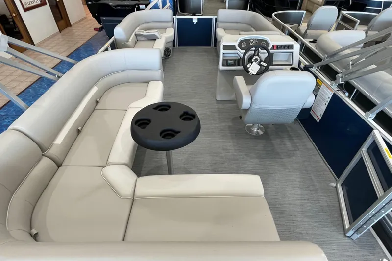 Slide: The Image of 2026 Godfrey Xperience 2086 CX pontoon boat interior with plush seating and modern helm. - 13