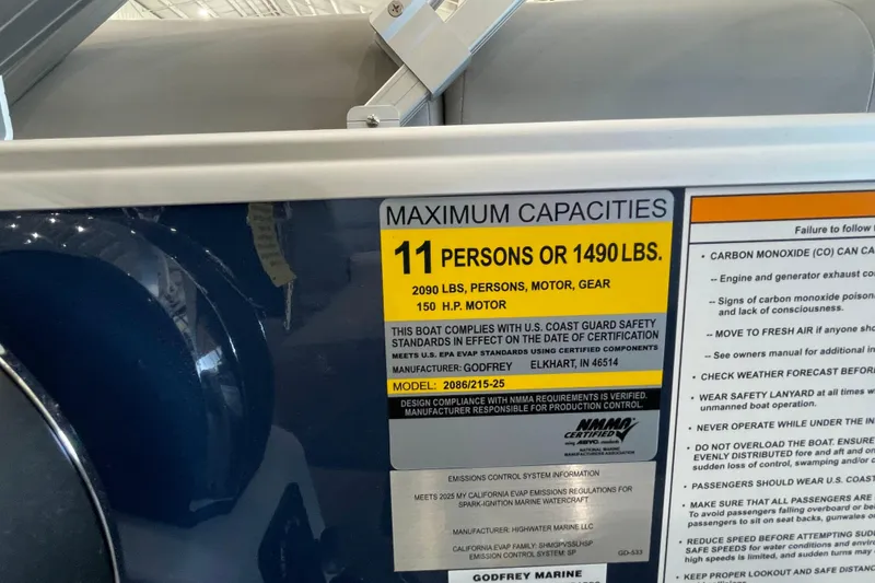 Slide: The Image of 2026 Godfrey Xperience 2086 CX capacity label, 11 persons or 1490 lbs, 150 HP motor. - 16