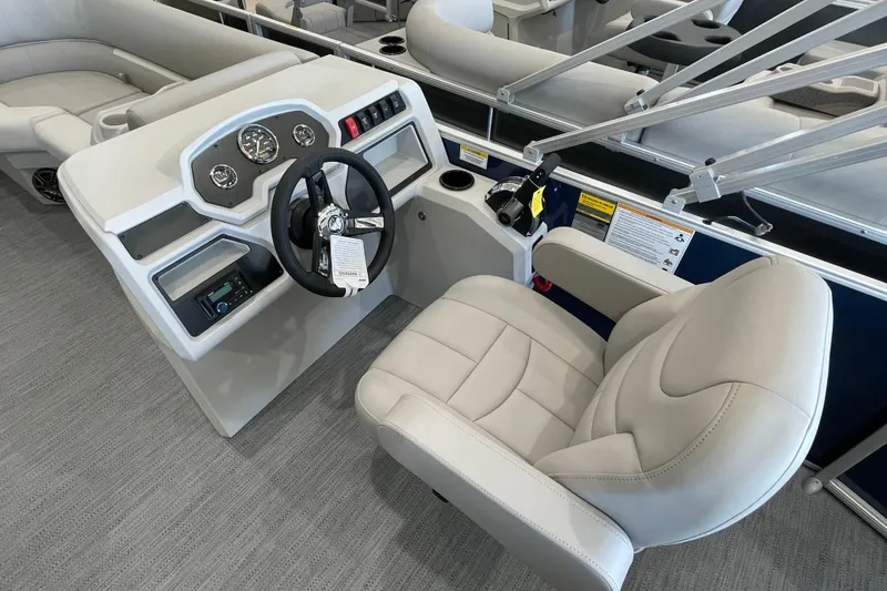 Slide: The Image of Captain's seat and helm of 2026 Godfrey Xperience 2086 CX pontoon boat, featuring modern controls. - 7