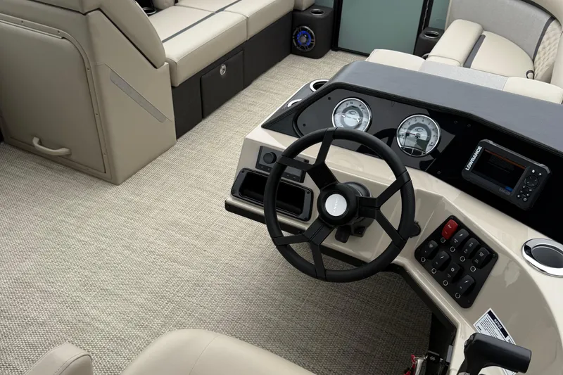 Slide: The Image of Interior of 2026 Crest 230 SLSC boat with modern dashboard and seating. - 8