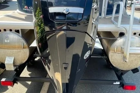 Slide: The Image of 2022 Sun Tracker Party Barge 20 DLX pontoon boat with outboard motor, rear view. - 10