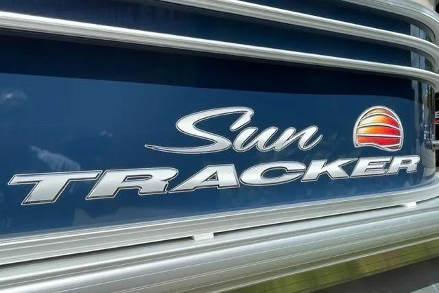 Slide: The Image of Sun Tracker Party Barge 20 DLX 2022 logo on blue background. - 4