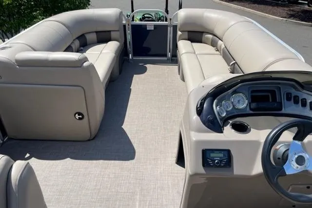 Slide: The Image of 2022 Sun Tracker Party Barge 20 DLX interior with spacious seating and modern dashboard. - 8