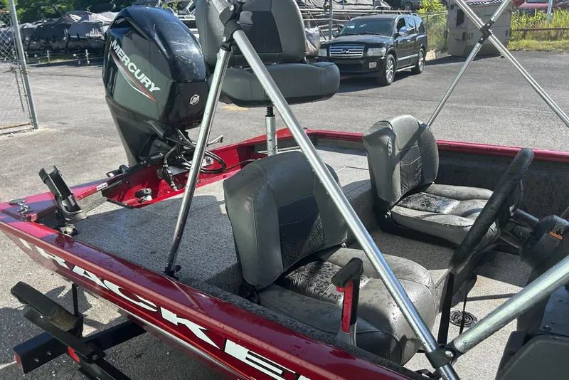 Slide: The Image of 2020 Bass Tracker Pro 170 boat with Mercury engine, parked outdoors. - 6