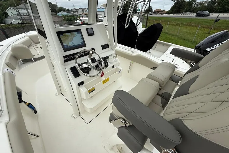 Slide: The Image of 2026 Key West 239 FS boat interior with modern dashboard and comfortable seating. - 10