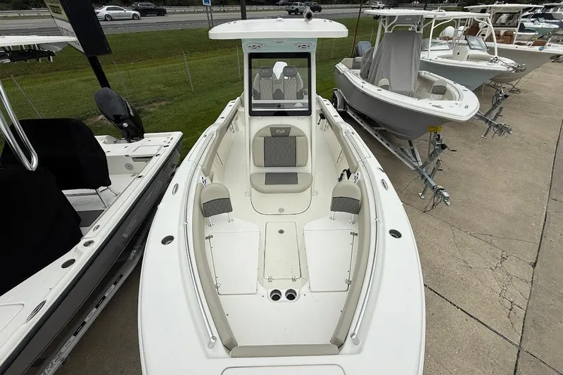 Slide: The Image of 2026 Key West 239 FS boat, white exterior, parked on a trailer, side view. - 14
