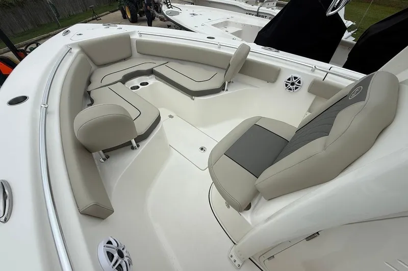 Slide: The Image of 2026 Key West 239 FS boat interior with beige seating and modern design. - 16