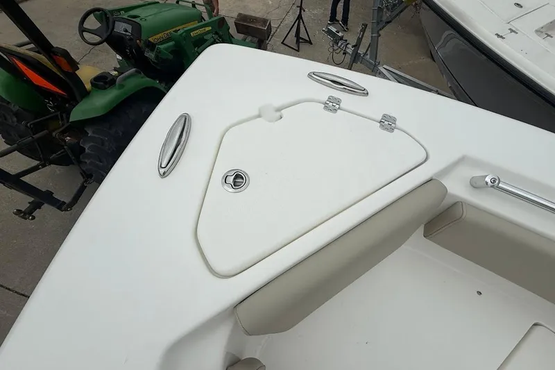 Slide: The Image of 2026 Key West 239 FS boat deck with storage compartment and seating. - 19