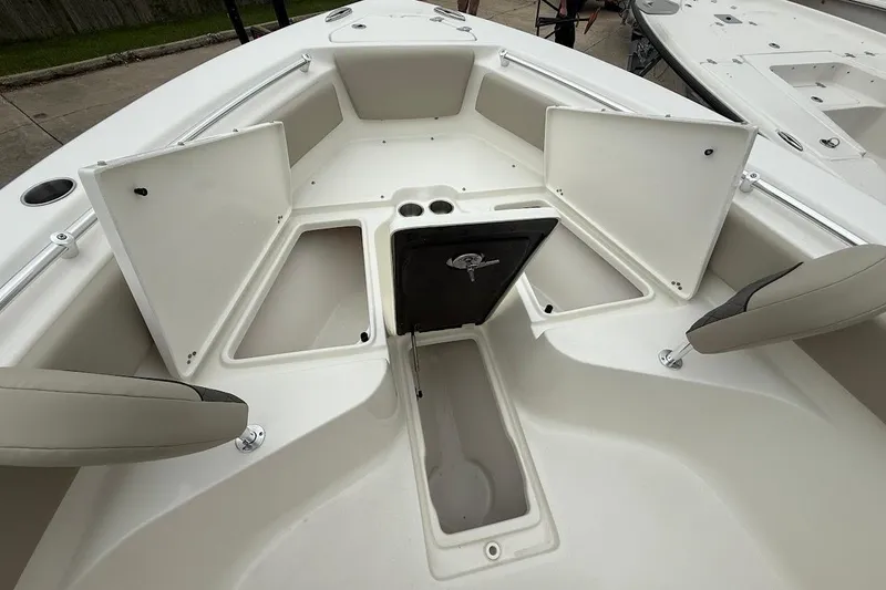 Slide: The Image of 2026 Key West 239 FS boat interior with open storage compartments and seating. - 20