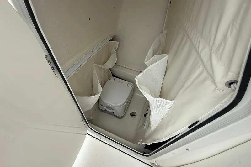 Slide: The Image of Compact marine toilet in 2026 Key West 239 FS boat cabin. - 22