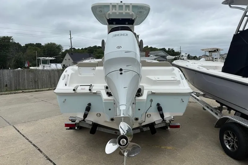 Slide: The Image of 2026 Key West 239 FS boat with powerful outboard motor, parked on a trailer. - 3