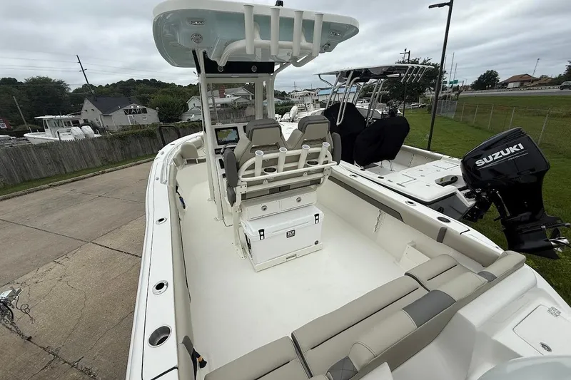 Slide: The Image of 2026 Key West 239 FS boat with Suzuki outboard motor, featuring spacious seating and modern design. - 5
