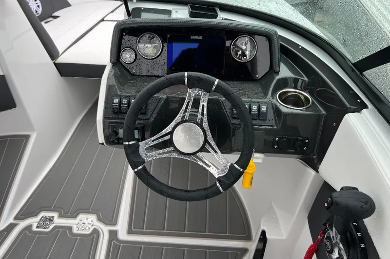Slide: The Image of Steering console of 2026 Monterey M-225 boat with modern controls and sleek design. - 10