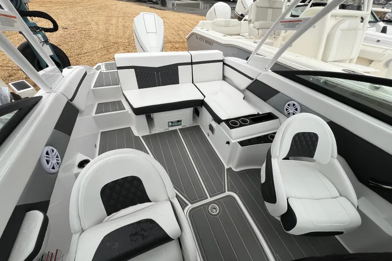 Slide: The Image of 2026 Monterey M-225 boat interior with modern seating and sleek design. - 12