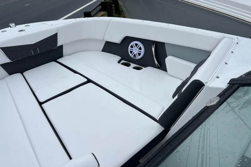 Slide: The Image of Luxurious seating area on 2026 Monterey M-225 boat with speaker and cup holders. - 14