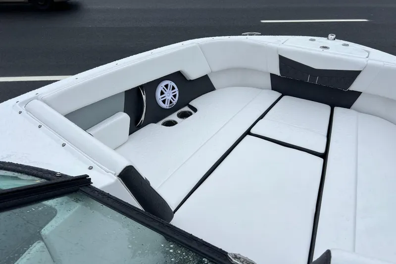 Slide: The Image of 2026 Monterey M-225 boat interior with white seating and speaker system. - 15