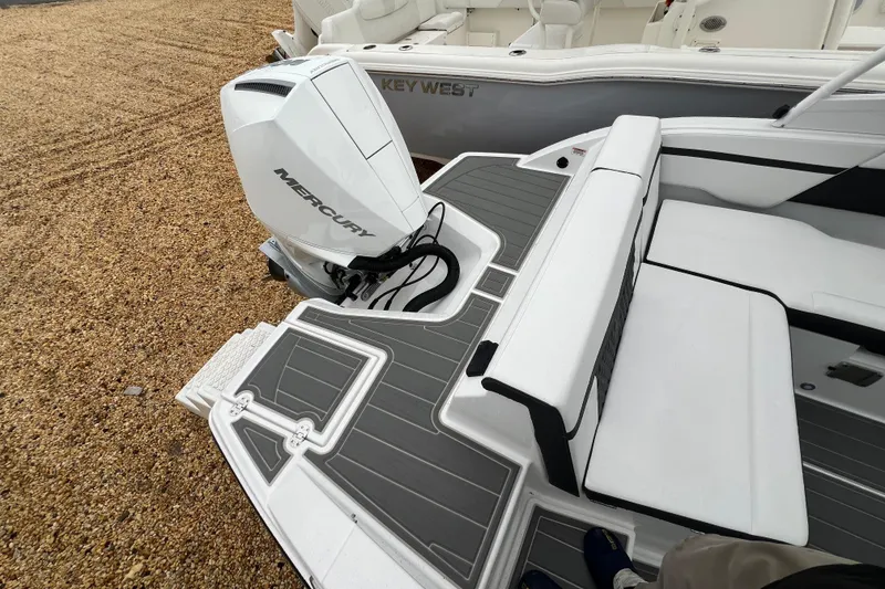 Slide: The Image of 2026 Monterey M-225 boat with Mercury outboard engine, featuring sleek seating and deck design. - 16