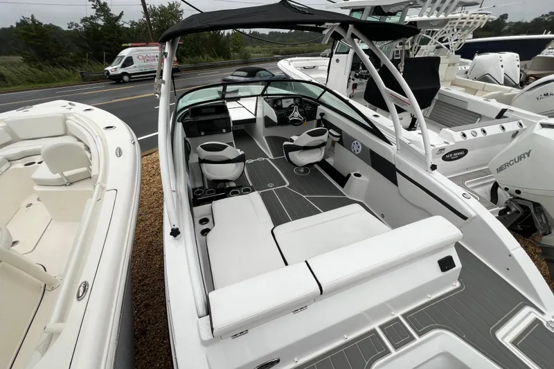 Slide: The Image of 2026 Monterey M-225 boat with sleek interior design and modern seating arrangement. - 20