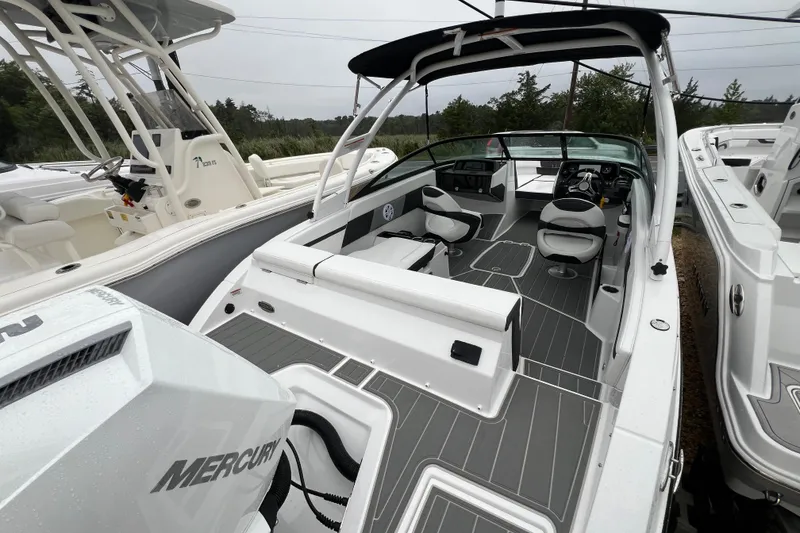 Slide: The Image of 2026 Monterey M-225 boat interior with sleek seating and modern dashboard design. - 21