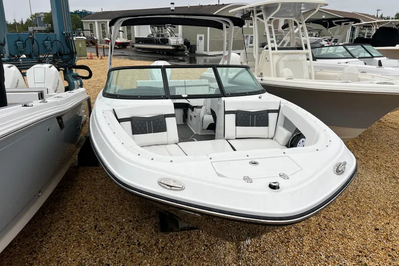 Slide: The Image of 2026 Monterey M-225 boat with sleek design, white exterior, and spacious seating. - 3