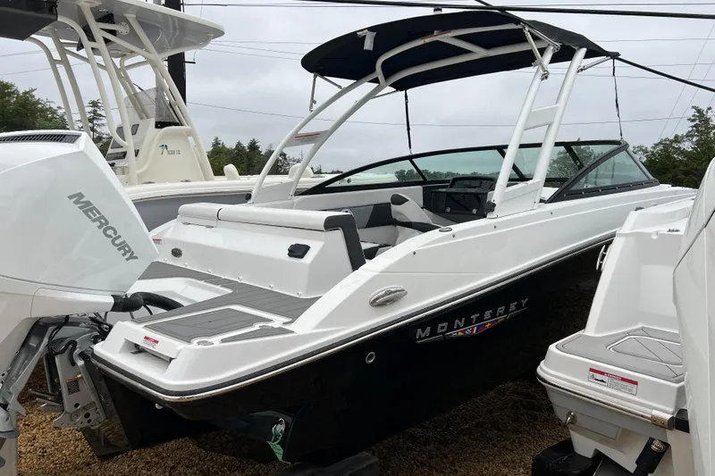 Slide: The Image of 2026 Monterey M-225 boat with Mercury engine, sleek design, and modern features. - 6