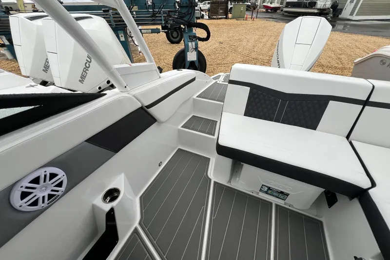 Slide: The Image of 2026 Monterey M-225 boat interior with sleek seating and modern design elements. - 8