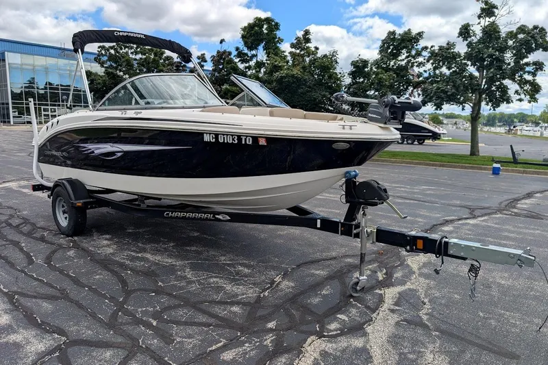 Slide: The Image of 2012 Chaparral 18 H2O Ski & Fish boat on trailer, parked outdoors. - 0