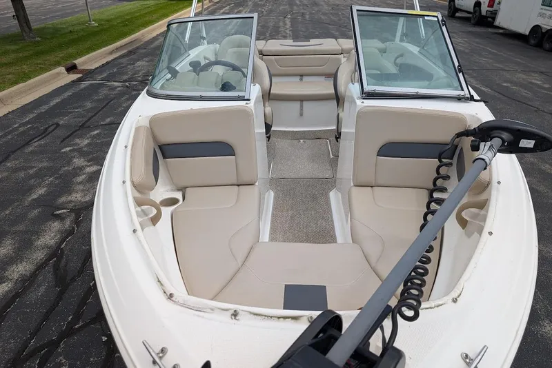 Slide: The Image of 2012 Chaparral 18 H2O Ski & Fish boat interior with seating and steering wheel. - 11
