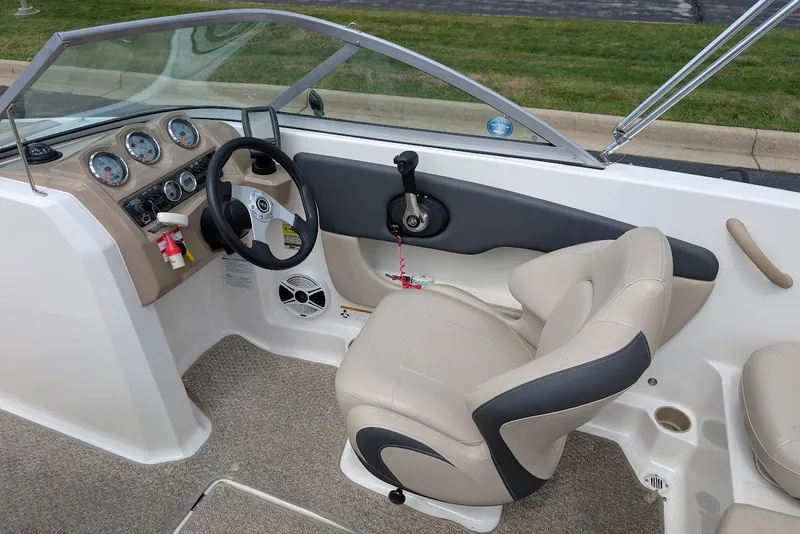 Slide: The Image of 2012 Chaparral 18 H2O Ski & Fish boat interior with steering wheel and dashboard controls. - 16
