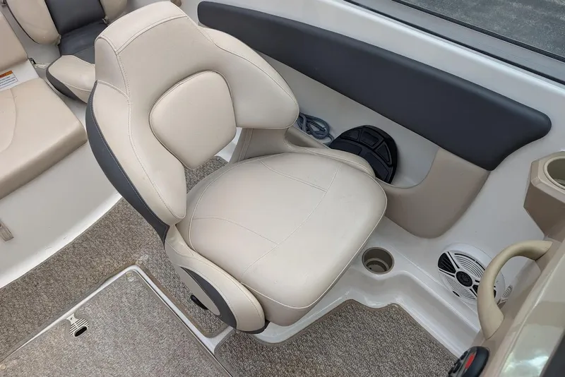 Slide: The Image of 2012 Chaparral 18 H2O Ski & Fish boat interior with beige seating and carpeted floor. - 20