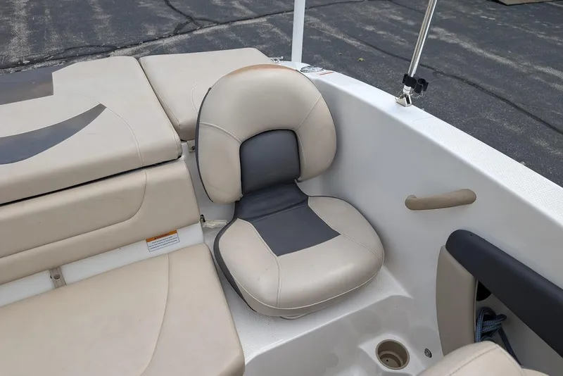 Slide: The Image of 2012 Chaparral 18 H2O Ski & Fish boat interior with beige and gray seating. - 22