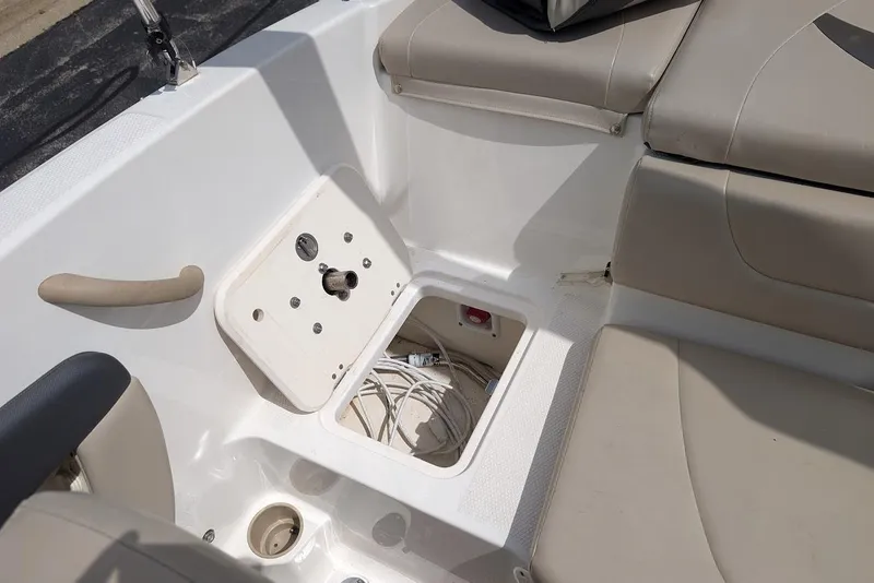 Slide: The Image of 2012 Chaparral 18 H2O Ski & Fish boat interior with storage compartment open. - 24