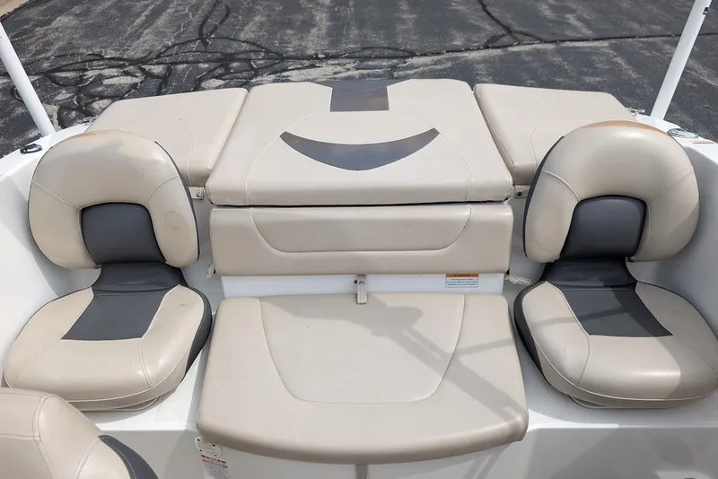 Slide: The Image of 2012 Chaparral 18 H2O Ski & Fish boat interior with beige seating arrangement. - 26