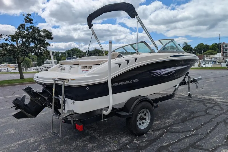 Slide: The Image of 2012 Chaparral 18 H2O Ski & Fish boat on trailer, parked outdoors. - 3