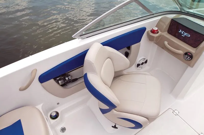 Slide: The Image of Manufacturer Provided Image: 2012 Chaparral 18 Ski & Fish H2O boat interior with beige and blue seating. - 35
