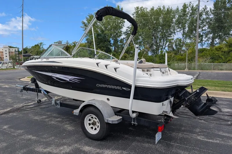 Slide: The Image of 2012 Chaparral 18 H2O Ski & Fish boat on trailer, parked outdoors. - 5