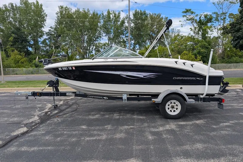 Slide: The Image of 2012 Chaparral 18 H2O Ski & Fish boat on trailer, parked outdoors. - 6