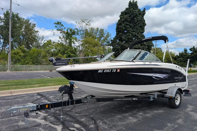 Slide: The Image of 2012 Chaparral 18 H2O Ski & Fish boat on trailer, parked outdoors. - 7