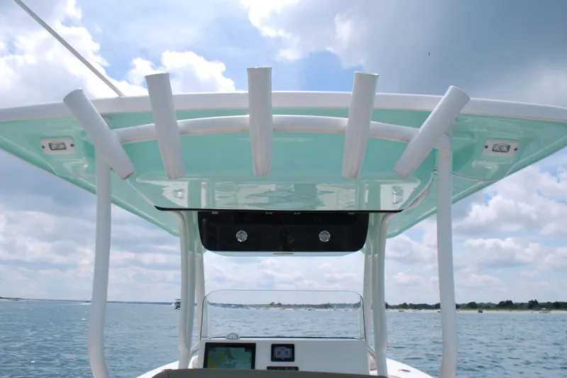 Slide: The Image of 2022 Key West 263 FS boat with T-top, ocean view, and clear sky. - 12