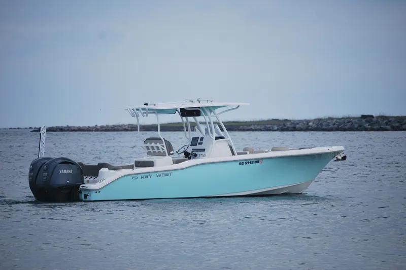 Slide: The Image of 2022 Key West 263 FS boat with Yamaha engine on calm water. - 3