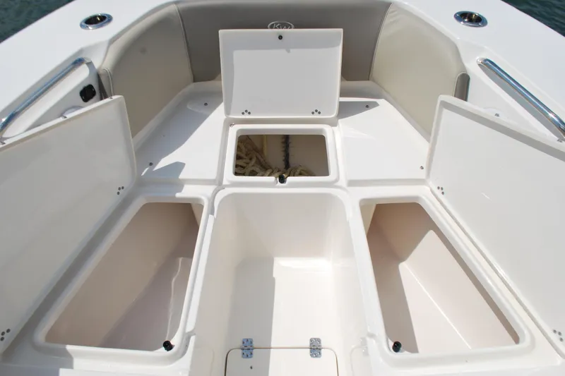 Slide: The Image of 2022 Key West 263 FS boat storage compartments with open hatches, showcasing spacious design. - 6
