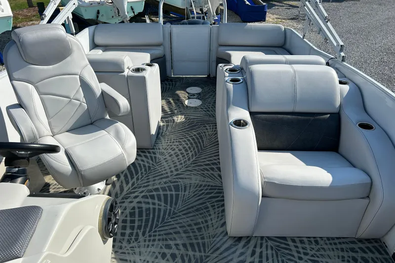 Slide: The Image of 2016 Crest Classic 250 SLR2 boat interior with plush seating and cup holders. - 11