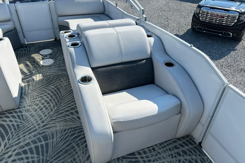 Slide: The Image of 2016 Crest Classic 250 SLR2 boat interior with plush seating and cup holders. - 12