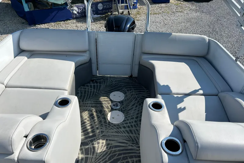 Slide: The Image of 2016 Crest Classic 250 SLR2 boat interior with gray seating and cup holders. - 14