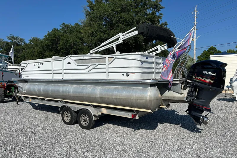 Slide: The Image of 2016 Crest Classic 250 SLR2 pontoon boat with Yamaha outboard motor on trailer. - 3